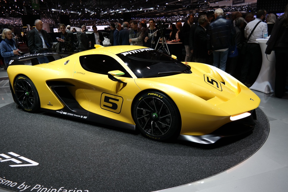 Aerodynamic yellow sports racing car with sleek body and performance wheels