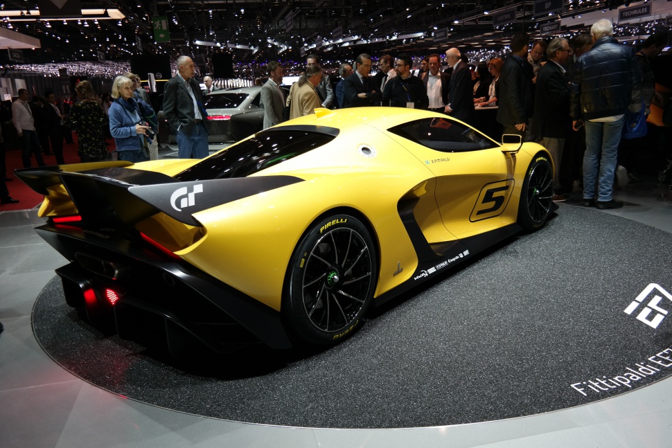 Yellow racing sports car with large rear wing and number 5 decal