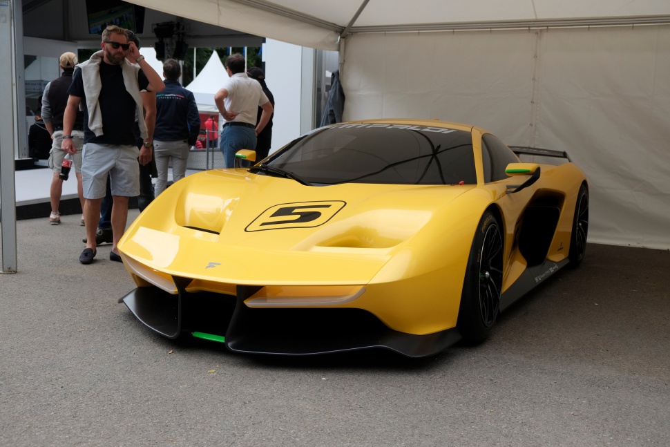 Yellow supercar with aerodynamic front and number 5 decal