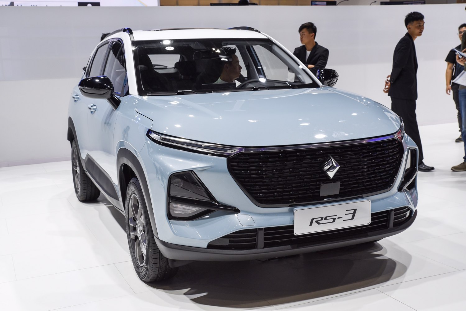 Front view with distinctive black grille and modern LED headlights