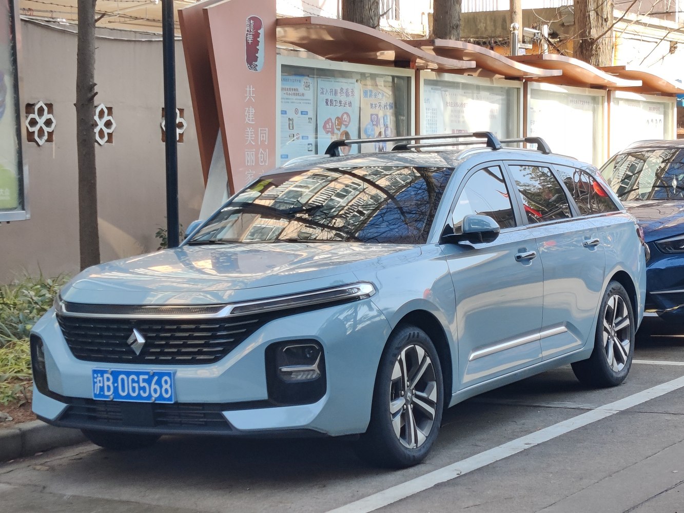 Modern station wagon with horizontal LED headlights and roof rails