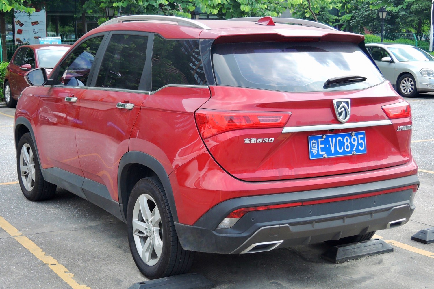 Rear view of red SUV with distinct taillights and rear bumper