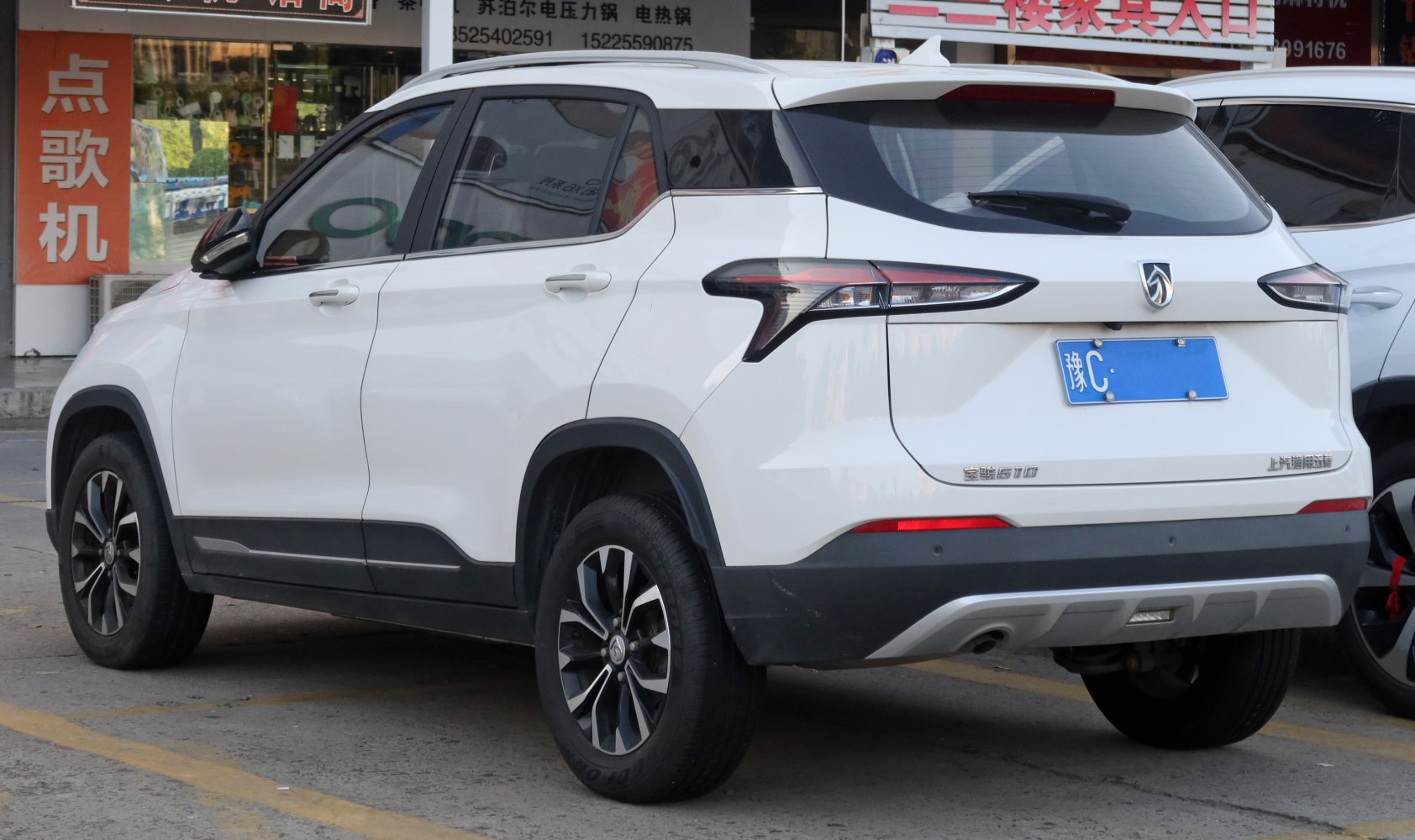 Rear and side profile with distinct taillights and wheel design