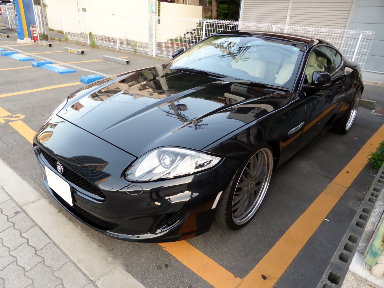 Sleek front view with distinct headlights and wide sporty wheels