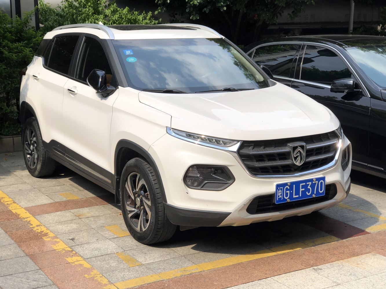 Front side view with LED headlights and modern grille design