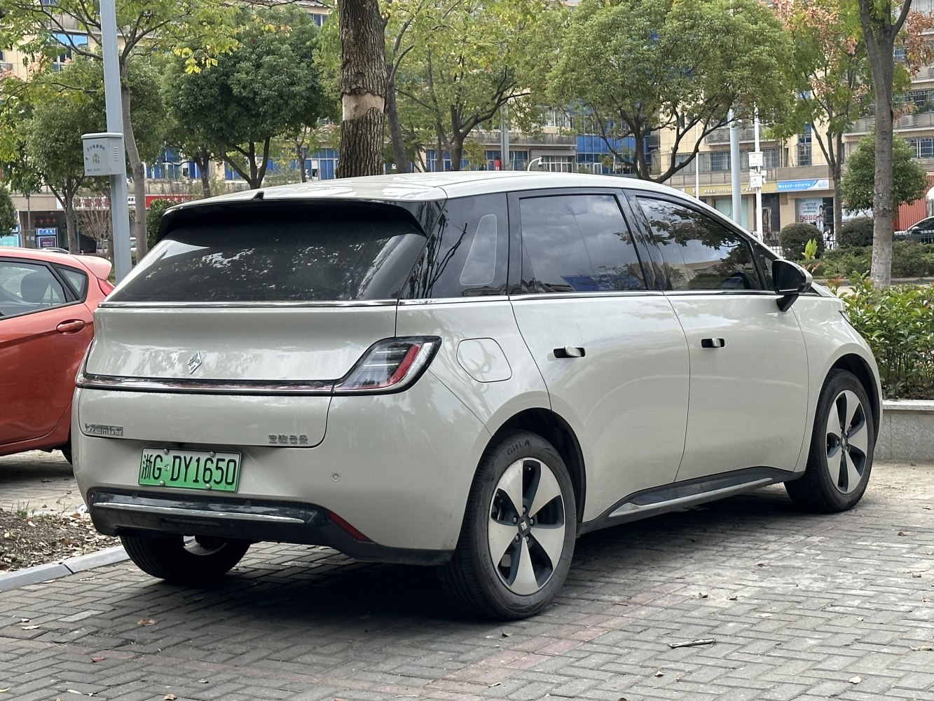 Rear and side view of modern electric hatchback with tinted windows and sleek taillights