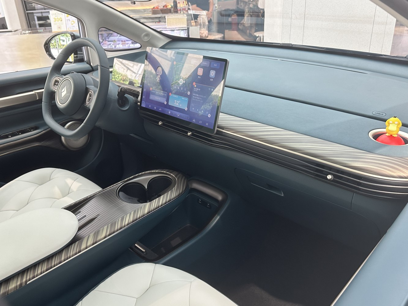 Digital dashboard and floating infotainment touchscreen in a modern car interior