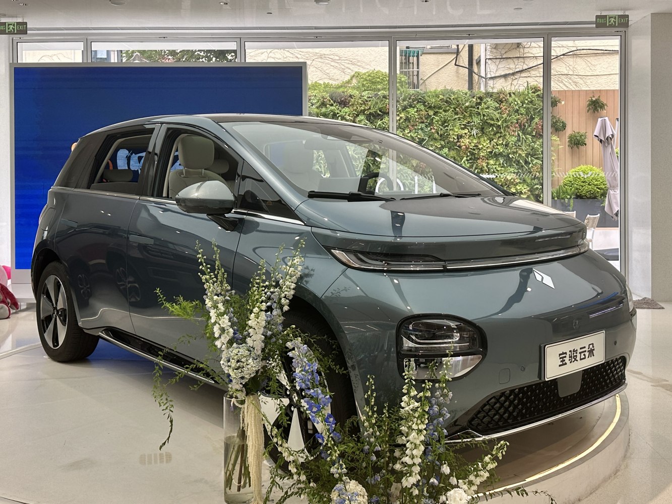 Sleek electric hatchback front and side with advanced lighting design