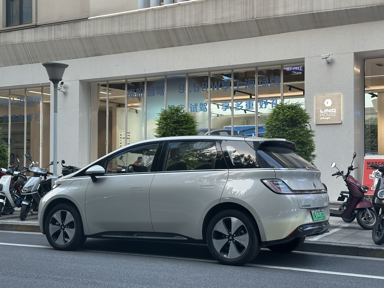 Side and rear view of a modern electric wagon with aerodynamic design and distinctive tail lights.