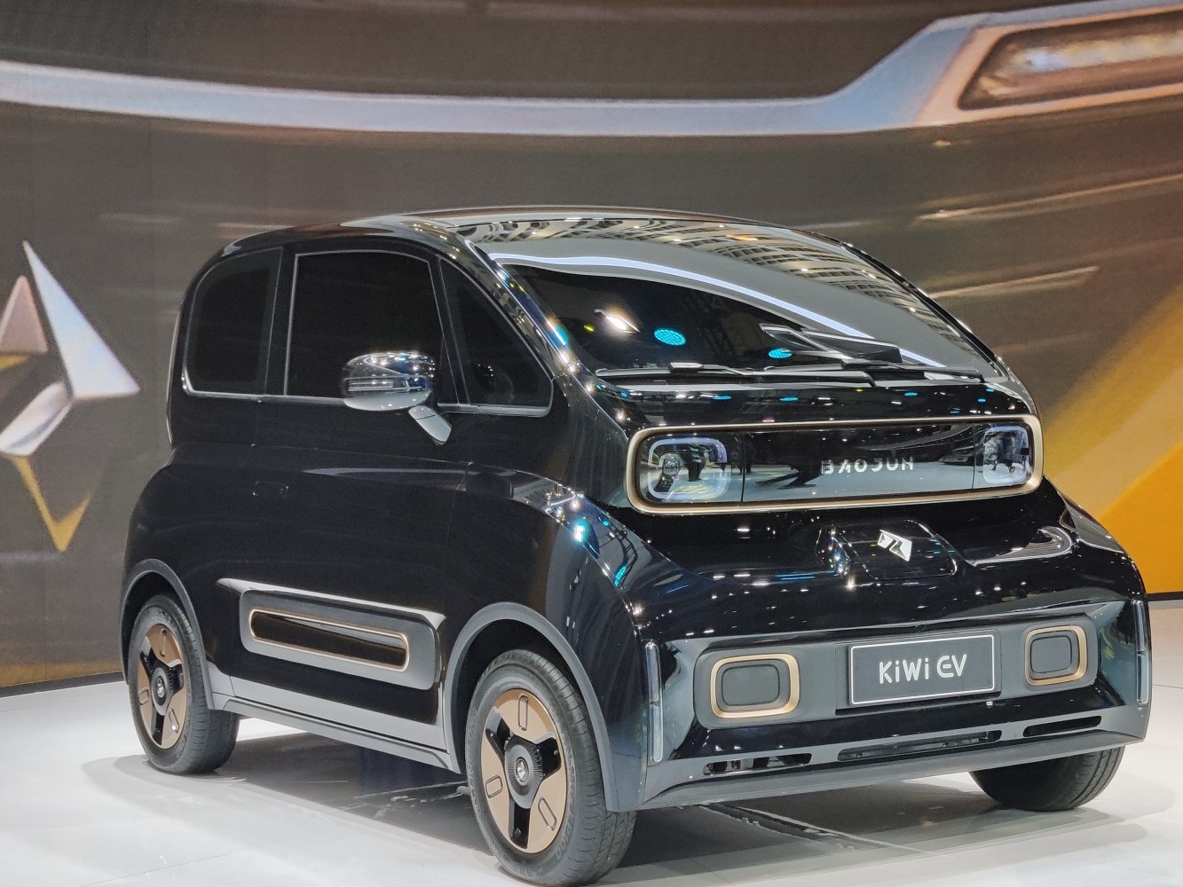 Compact electric vehicle with modern front design for urban use