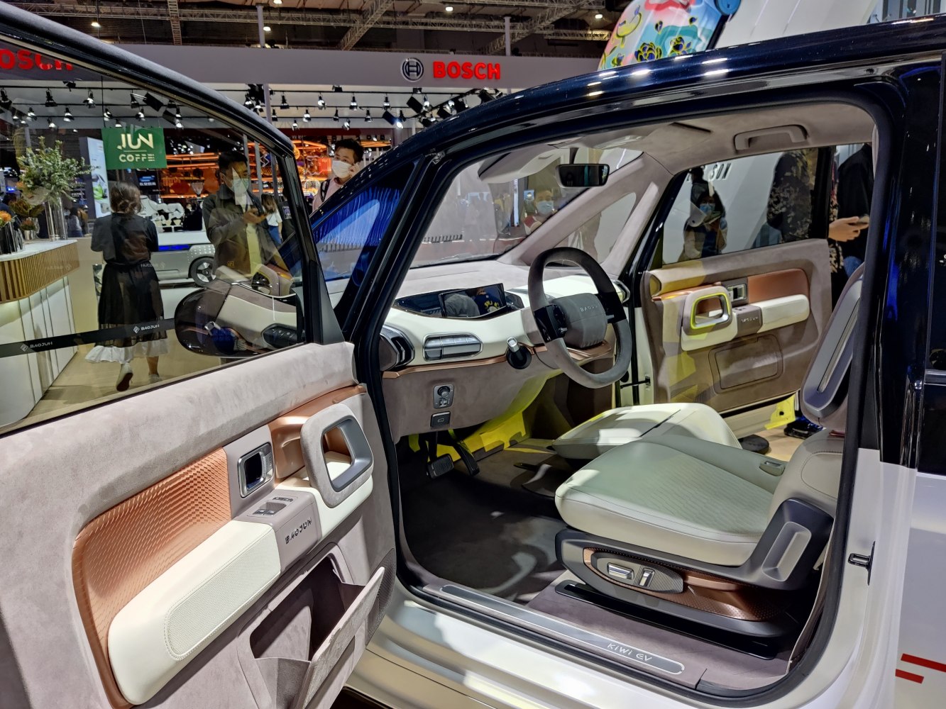 Modern dashboard and door panel with advanced controls in compact electric vehicle