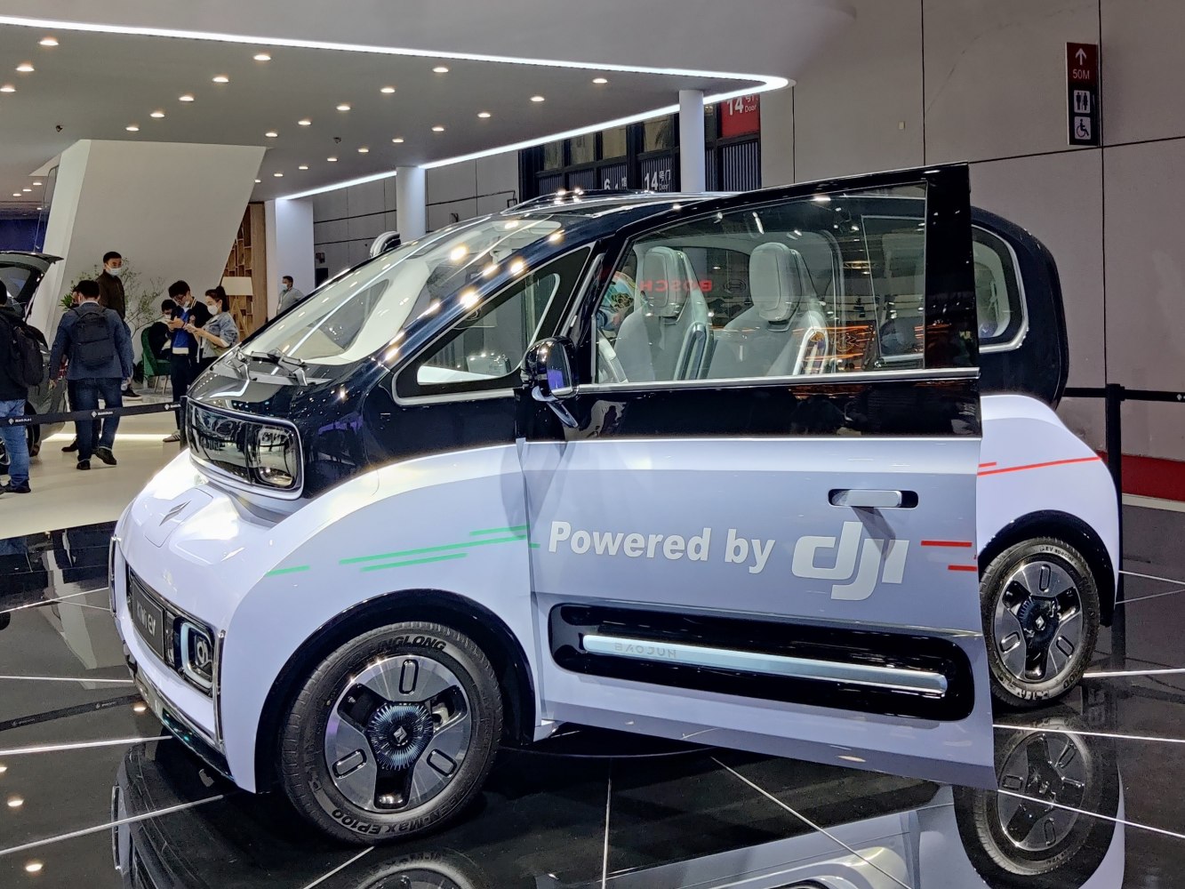 Compact electric microcar with unique front fascia and spacious interior seating