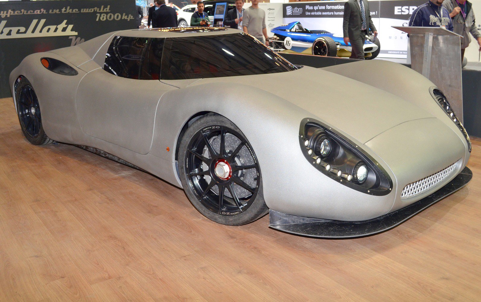 Aerodynamic matte-bodied supercar with prominent LED headlights