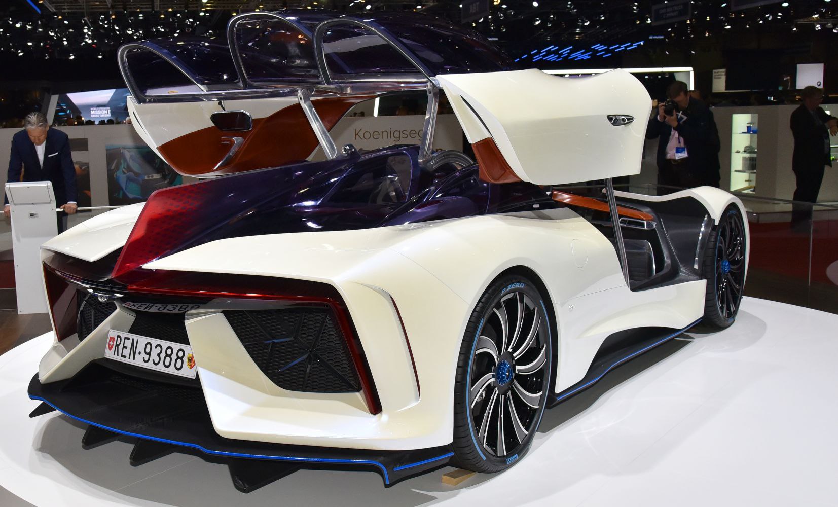 Reverse butterfly doors and aerodynamic rear design with sleek lines and large wheels.