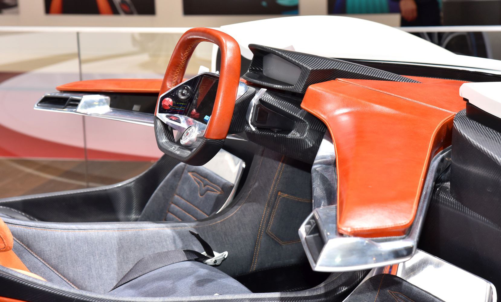 Futuristic steering wheel and dashboard in luxury car interior