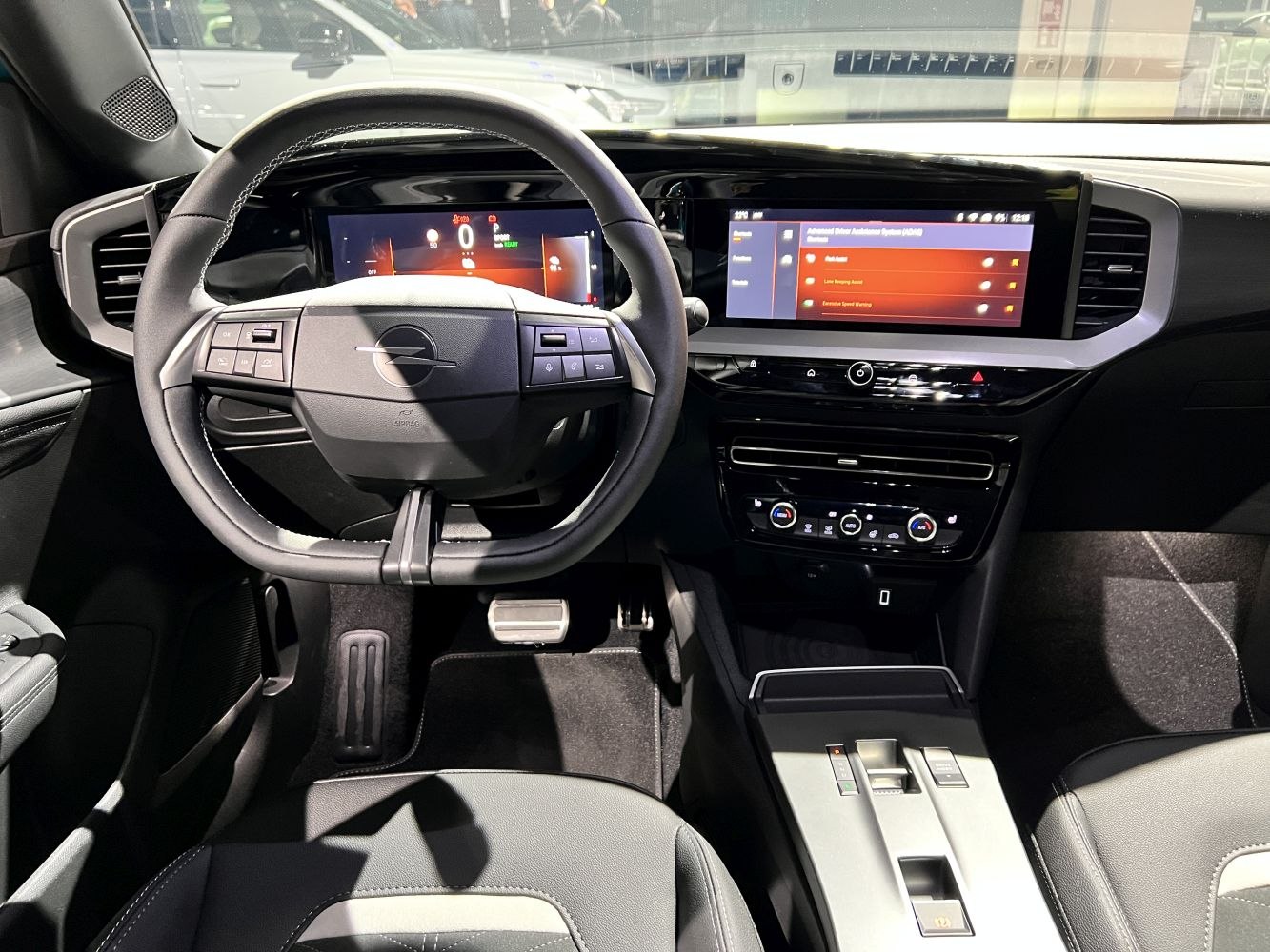 Digital instrument cluster and touchscreen infotainment system in modern car interior