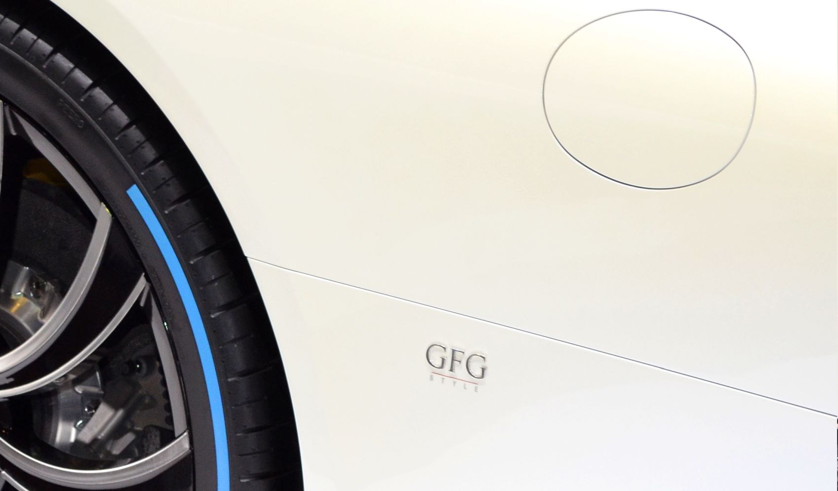 Close-up of wheel rim and fuel cap with GFG Style badge
