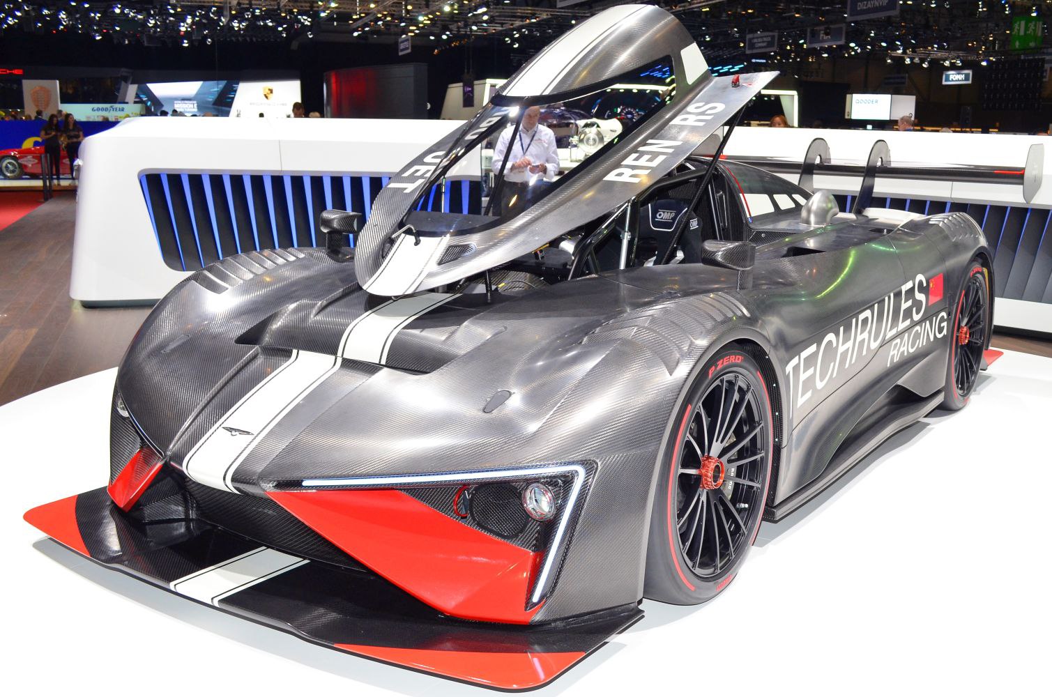 Carbon fiber racing prototype with canopy door and aerodynamic design