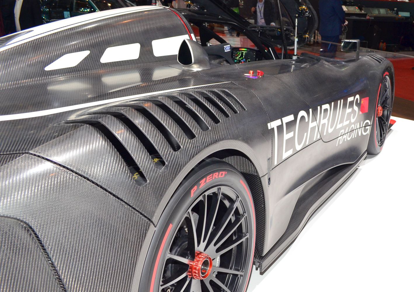 Carbon fiber body with side air vents and racing tire details