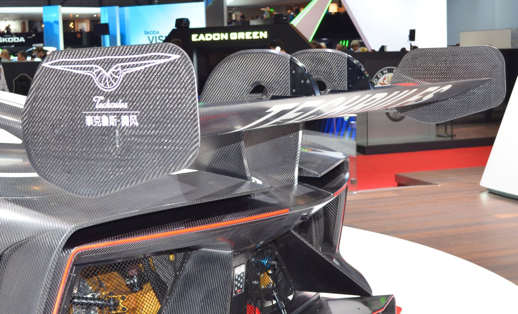 Carbon fiber rear wing with aerodynamic fins and Techrules branding