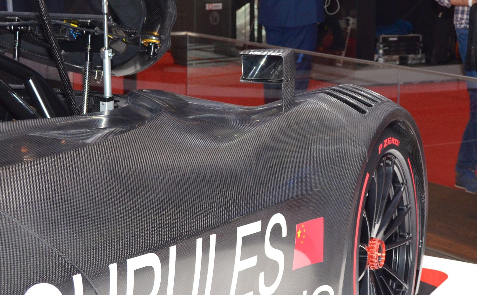 Carbon fiber body with racing wheel and aerodynamic side mirror