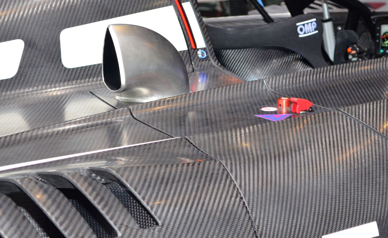 Carbon fiber side panel with aerodynamic air intake mirror