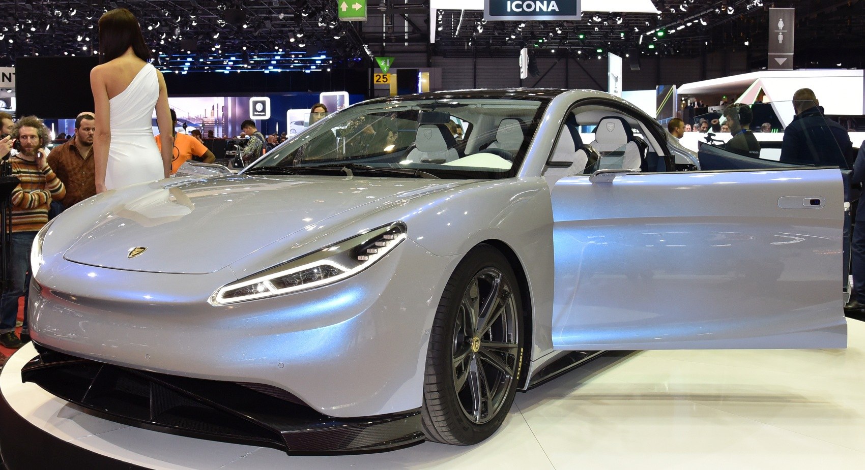 Sleek front and side view with open door and aerodynamic design