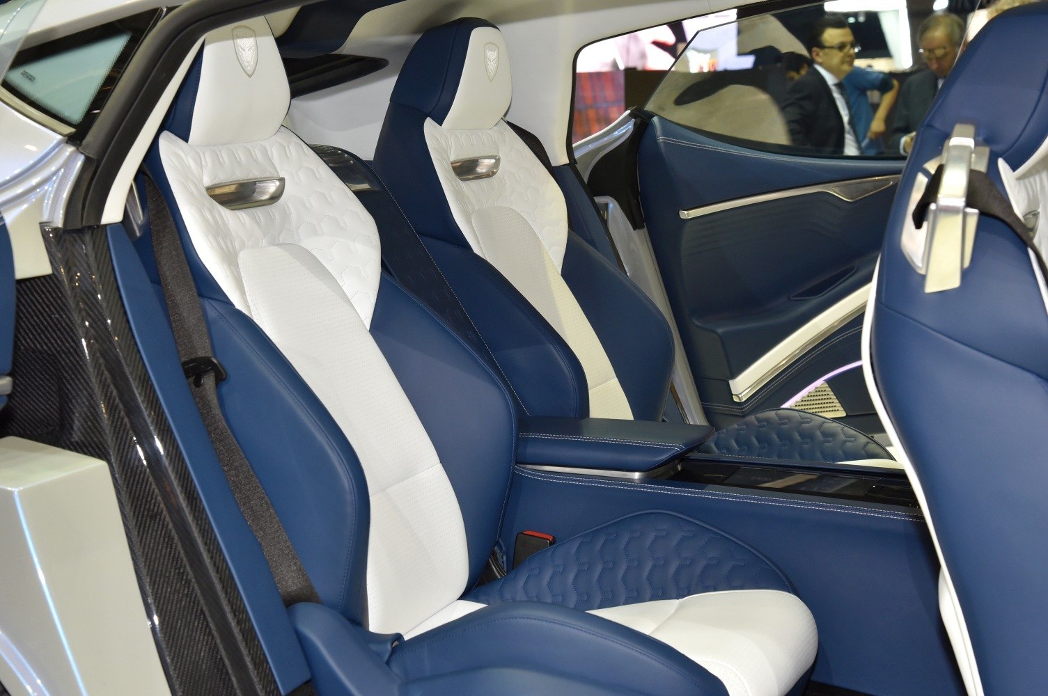 Blue and white leather car seats with detailed stitching and luxury features