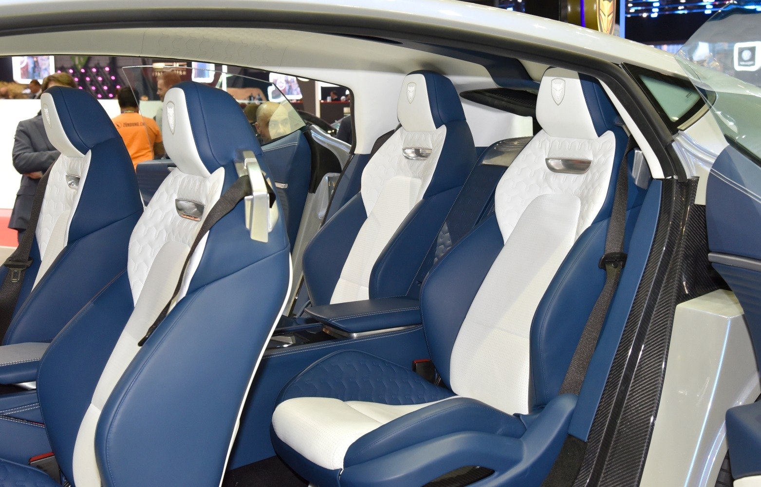 Blue and white leather seats with detailed stitching and integrated seatbelts