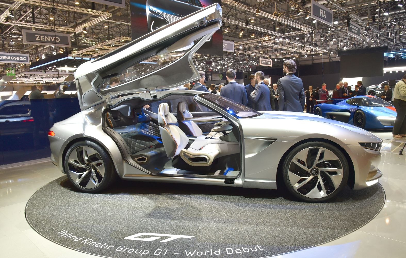 Sleek hybrid sports coupe with gullwing doors and modern interior design