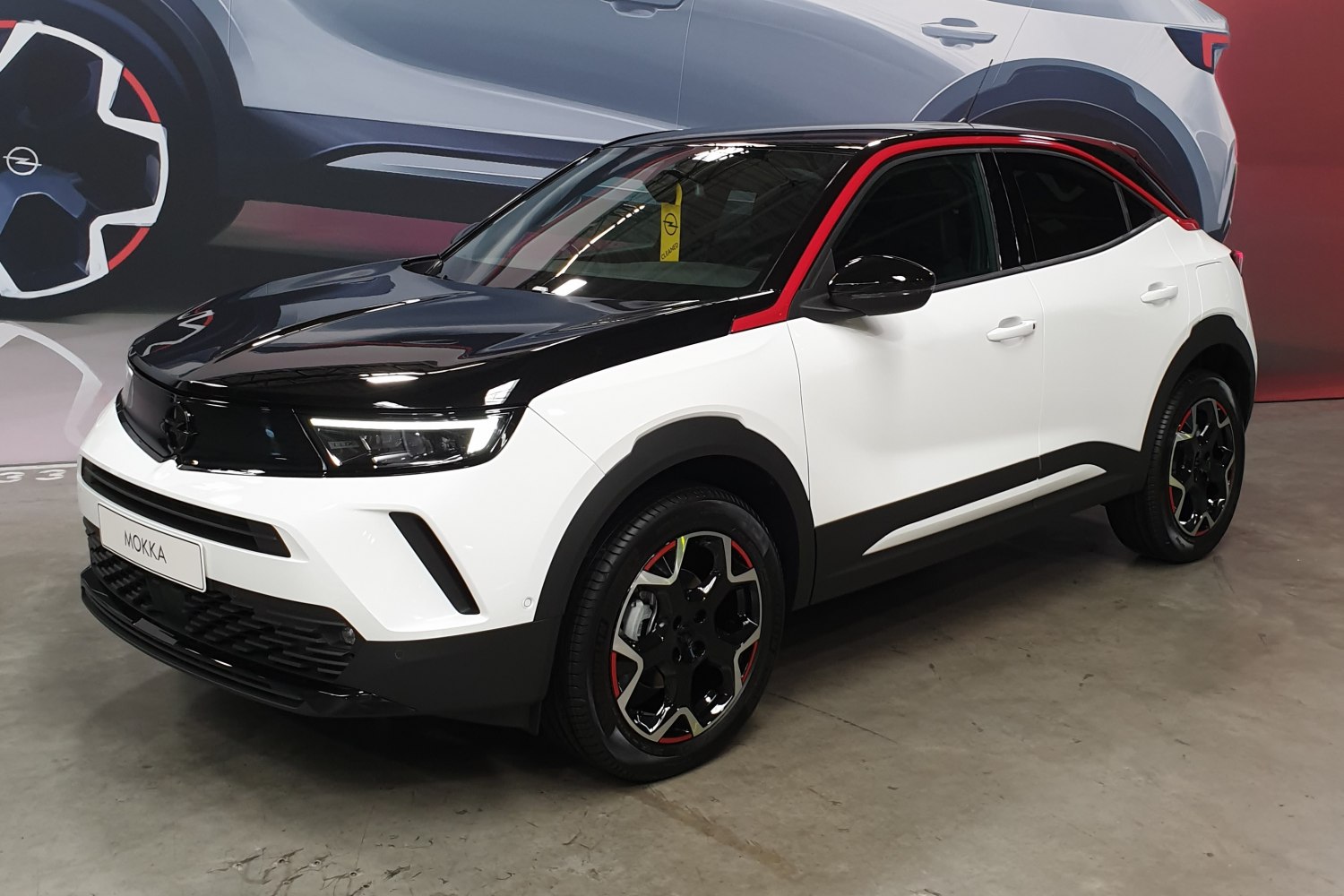 Compact SUV with black roof, red trim, and modern alloy wheels