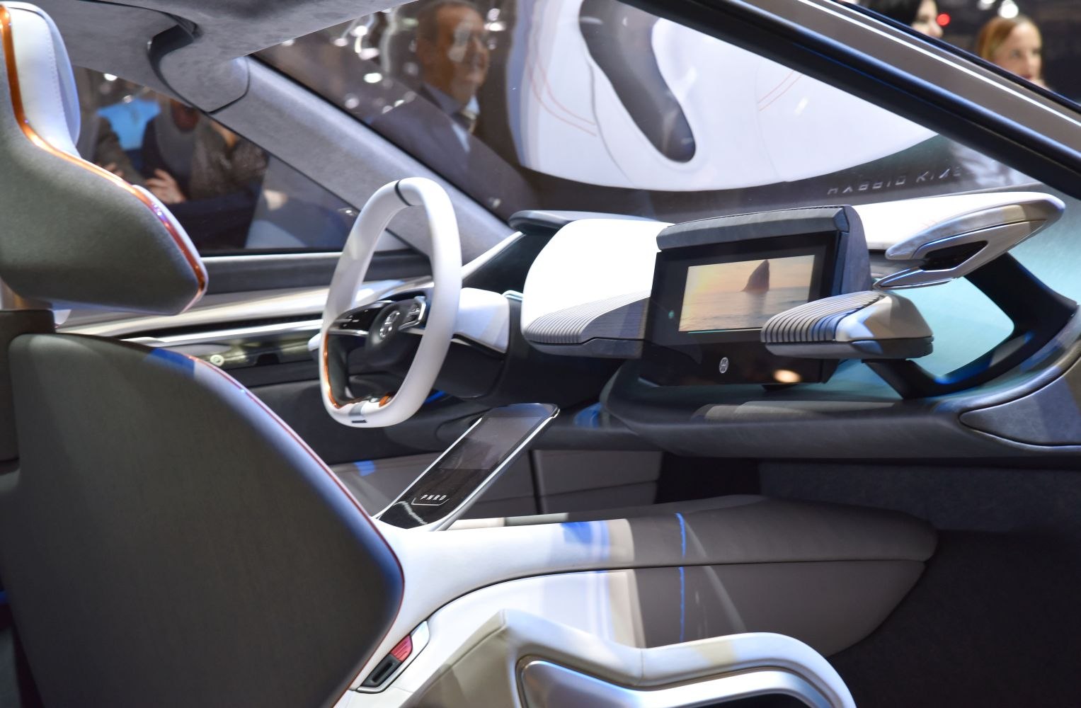 Futuristic interior with digital dashboard and unique steering wheel design
