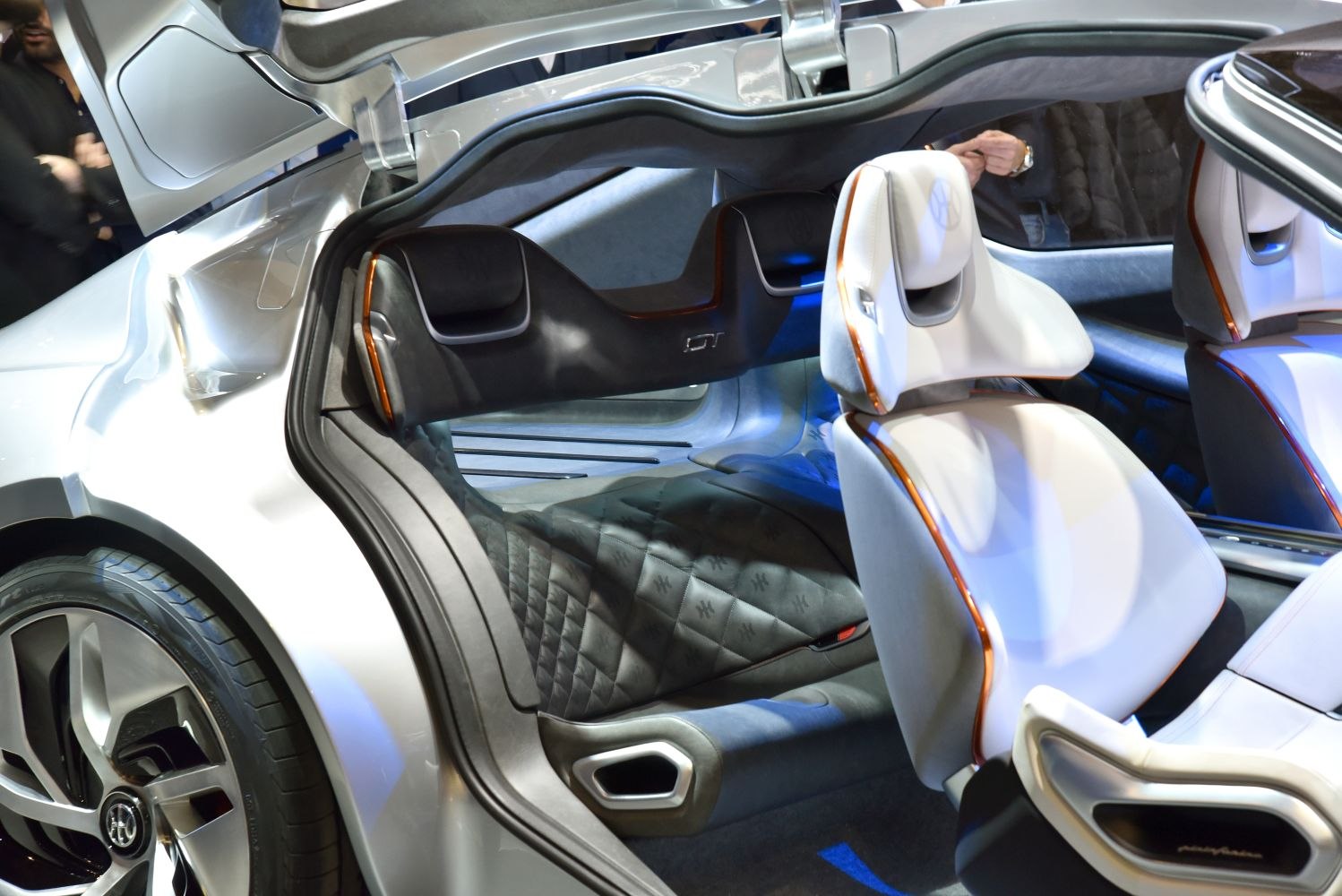 Futuristic gullwing door and modern quilted seating interior.