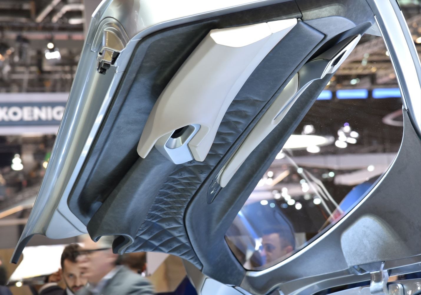 Quilted leather car door interior with sleek handle design