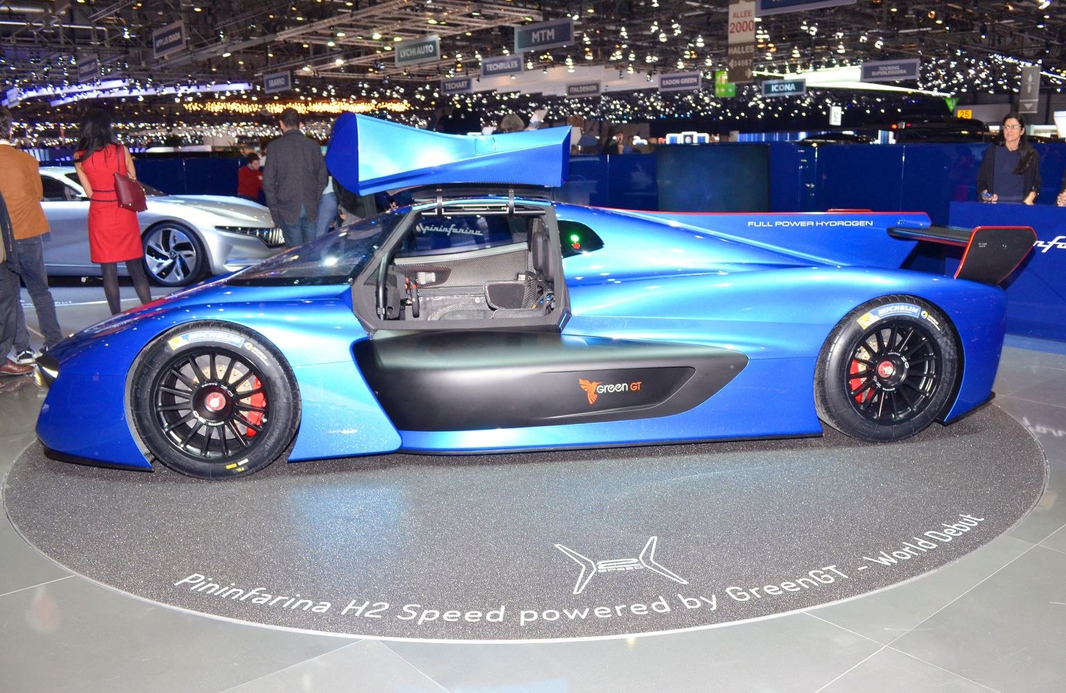 Blue hydrogen hypercar with gullwing door and aerodynamic design