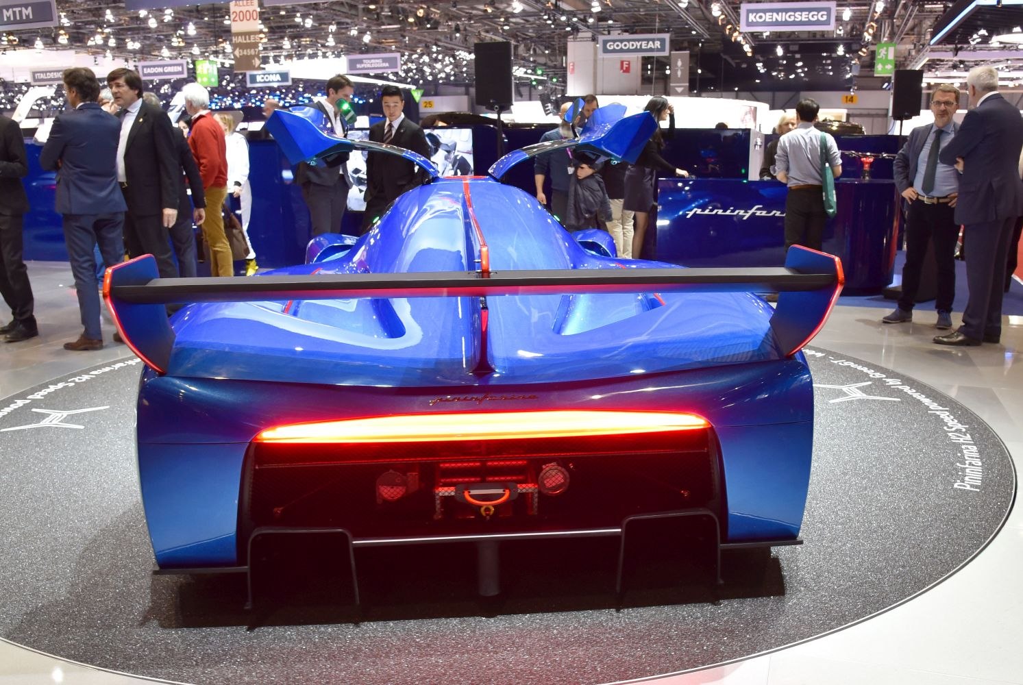 Blue race prototype with large rear wing and gullwing doors