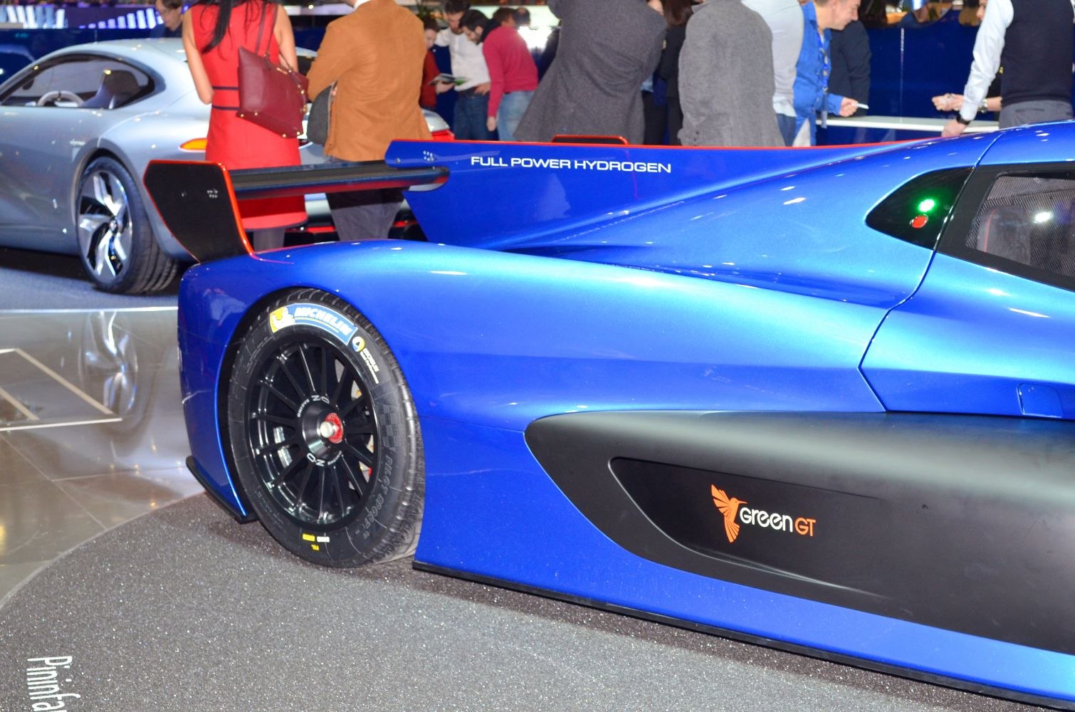 Hydrogen-powered race car rear with large aerodynamic wing and Michelin tire.