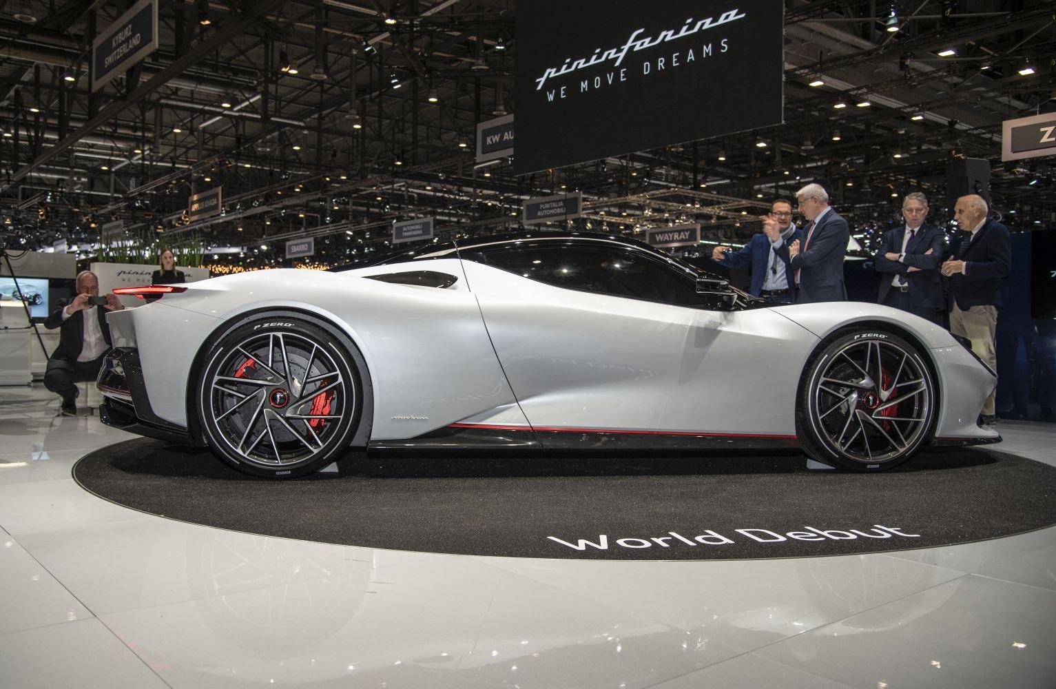 Sleek aerodynamic silhouette and sporty alloy wheels of a luxury electric supercar.