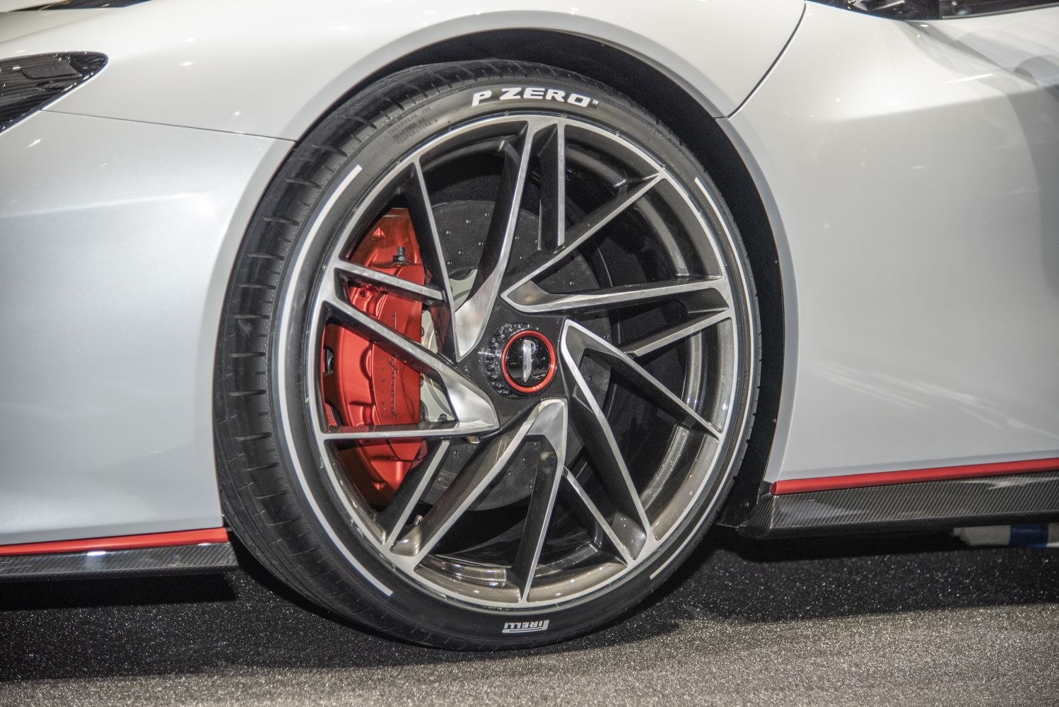 Sporty alloy wheel with red brake caliper and Pirelli P Zero tire
