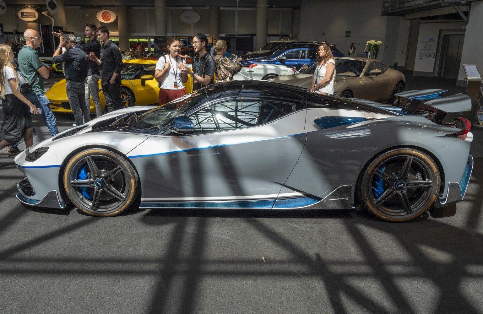 Low profile supercar with distinctive rear wing and sporty black wheels