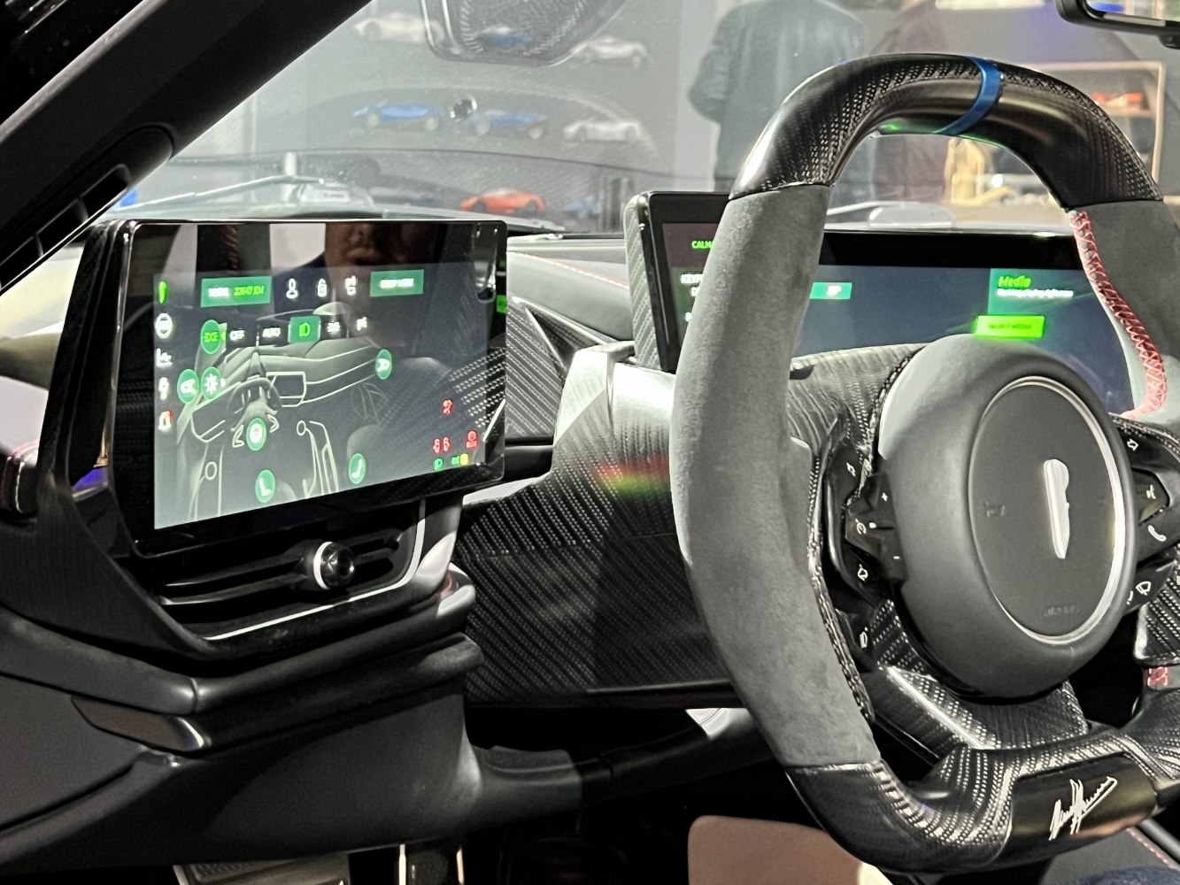 Digital instrument cluster and carbon fiber steering wheel