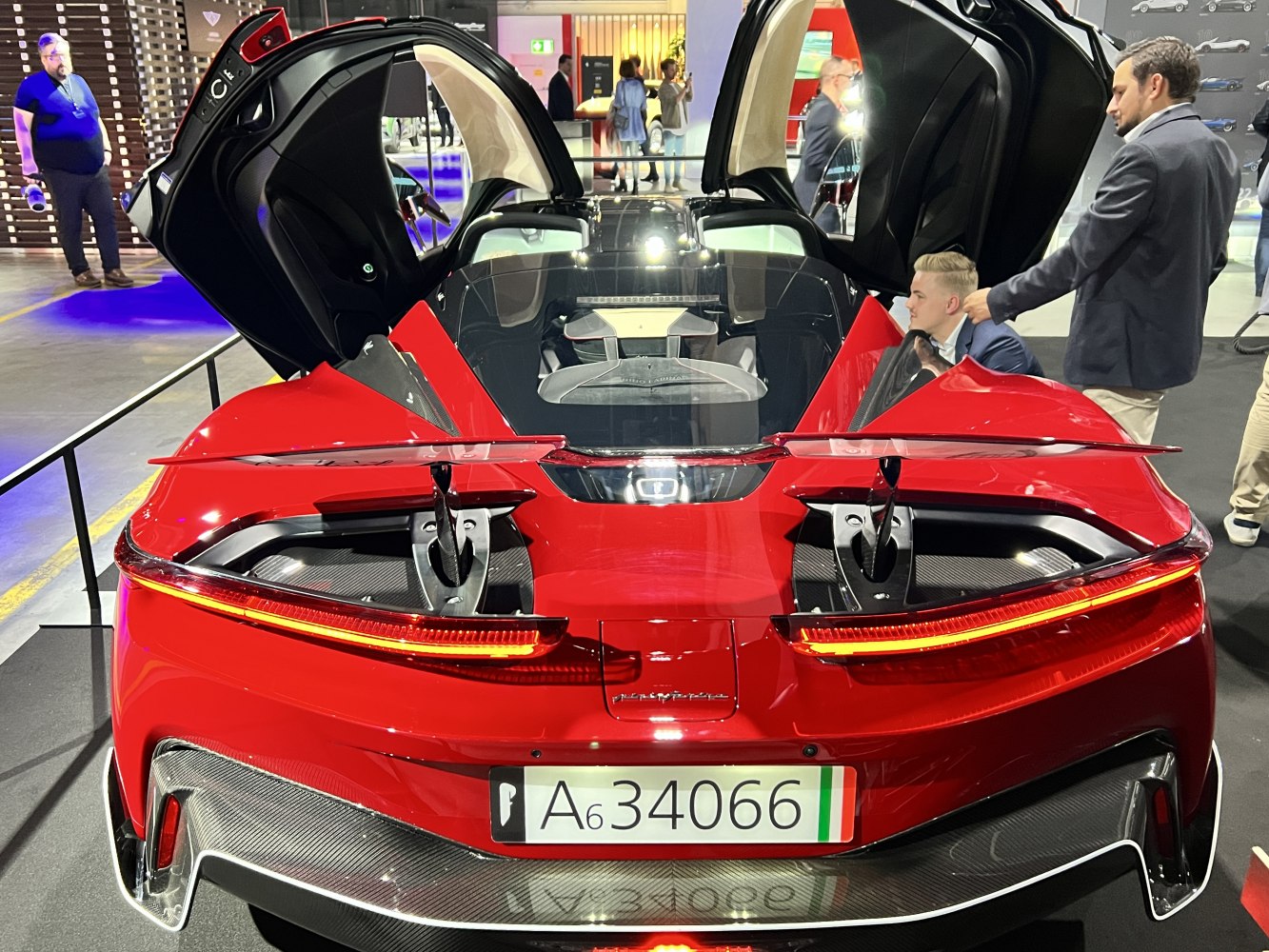Rear view of sports car with butterfly doors open