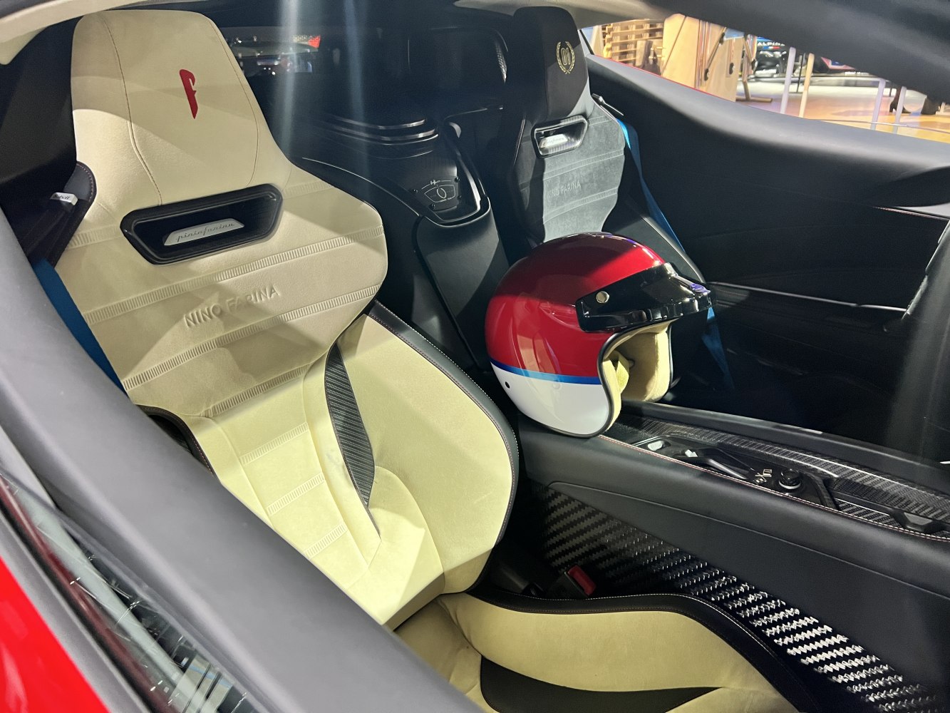 Racing seats and red-white-blue racing helmet inside car