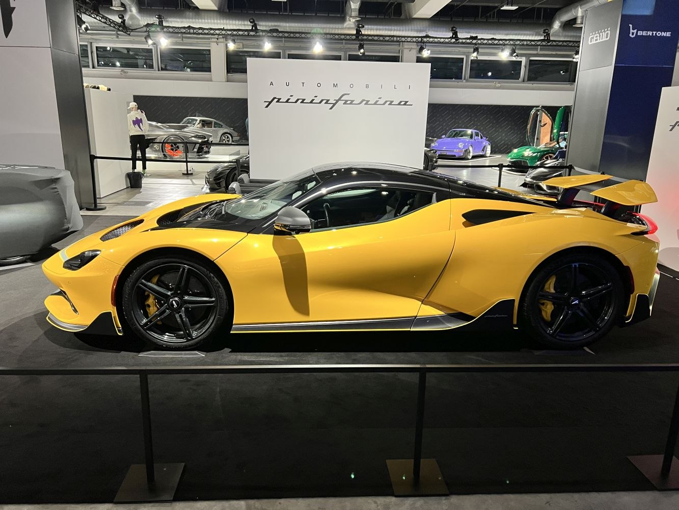 Yellow sports car with aerodynamic design and rear wing