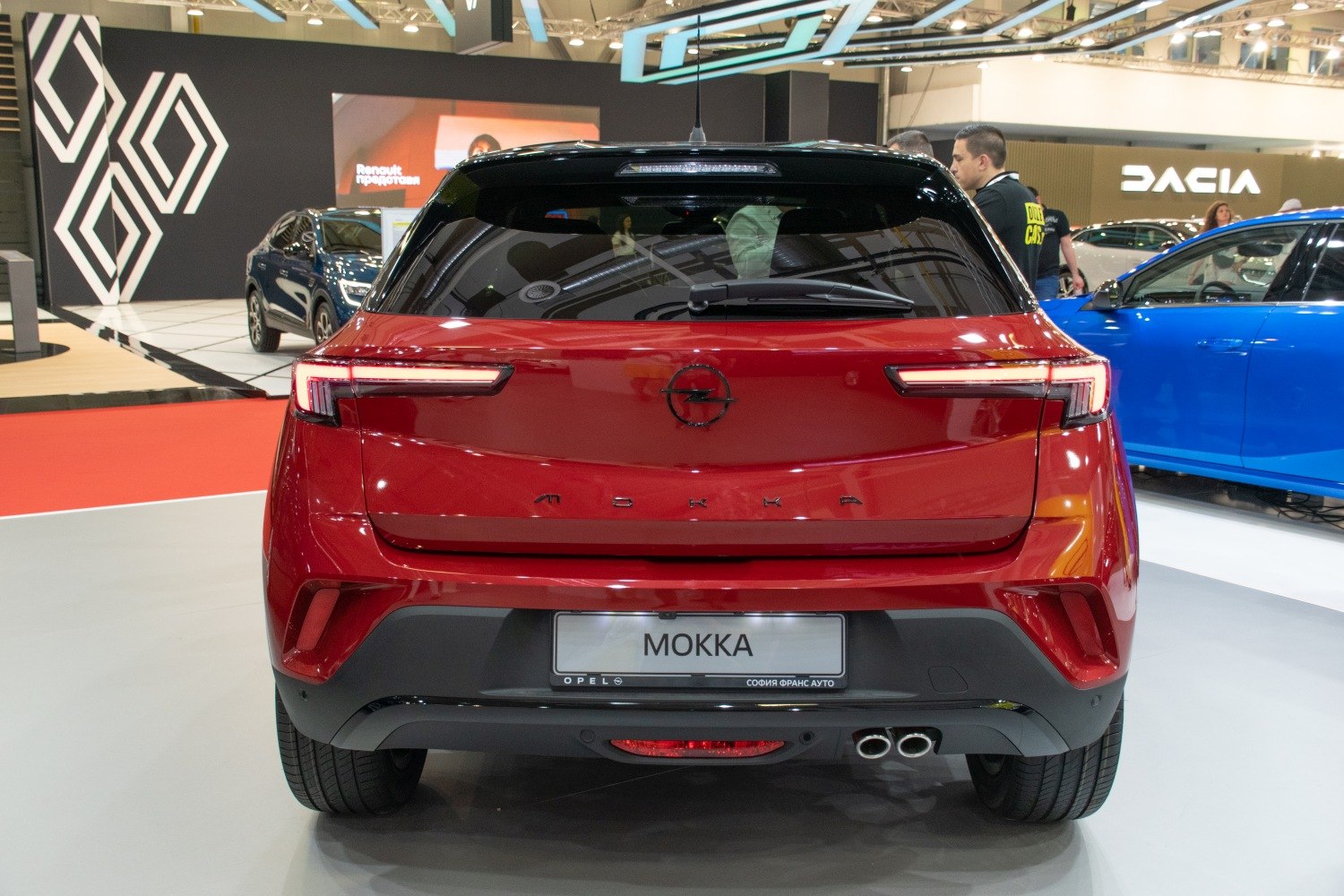 Rear of red hatchback with unique LED tail lights and dual exhaust pipes