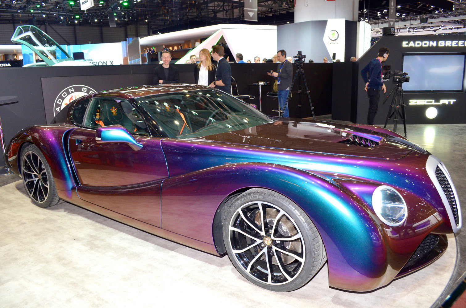 Retro-style luxury sports coupe with iridescent paint and modern alloy wheels