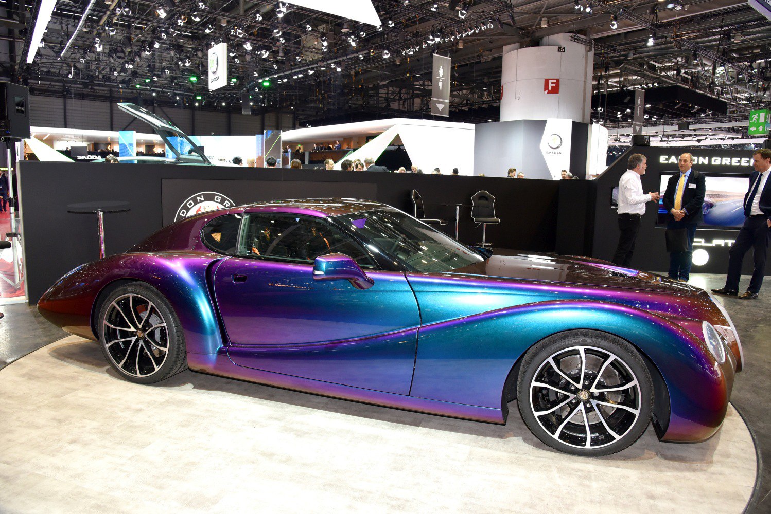Sleek aerodynamic sports coupe with iridescent paint and retro-modern curves