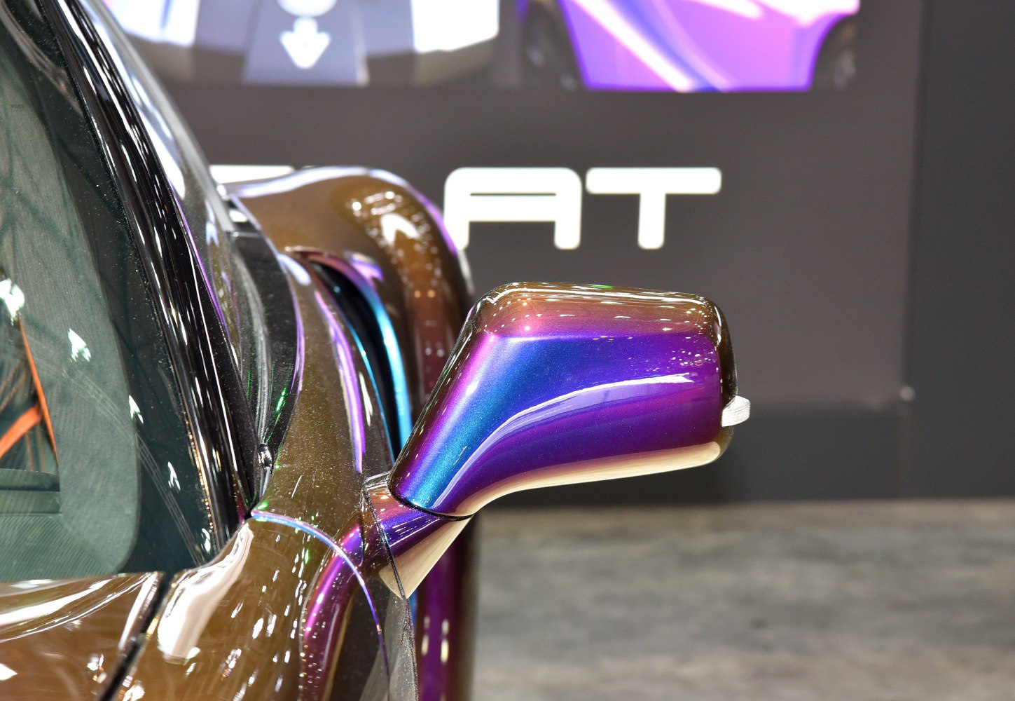 Iridescent aerodynamic car side mirror with sleek design