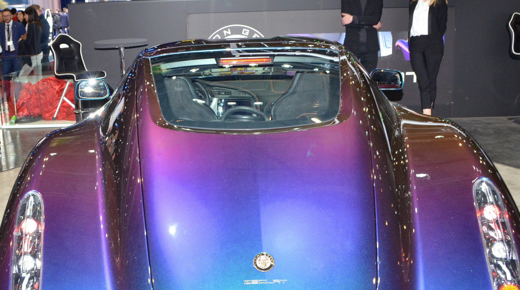 Rear view with sleek taillights and panoramic window, purple gradient finish