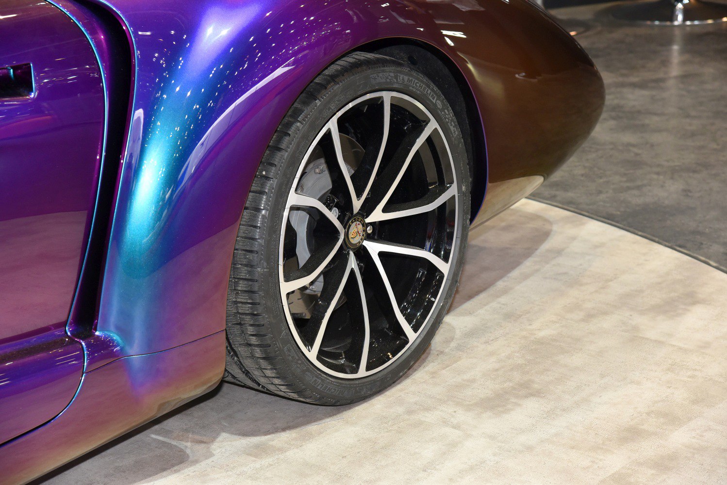 Stylish rear wheel with unique alloy rim and smooth iridescent body panel